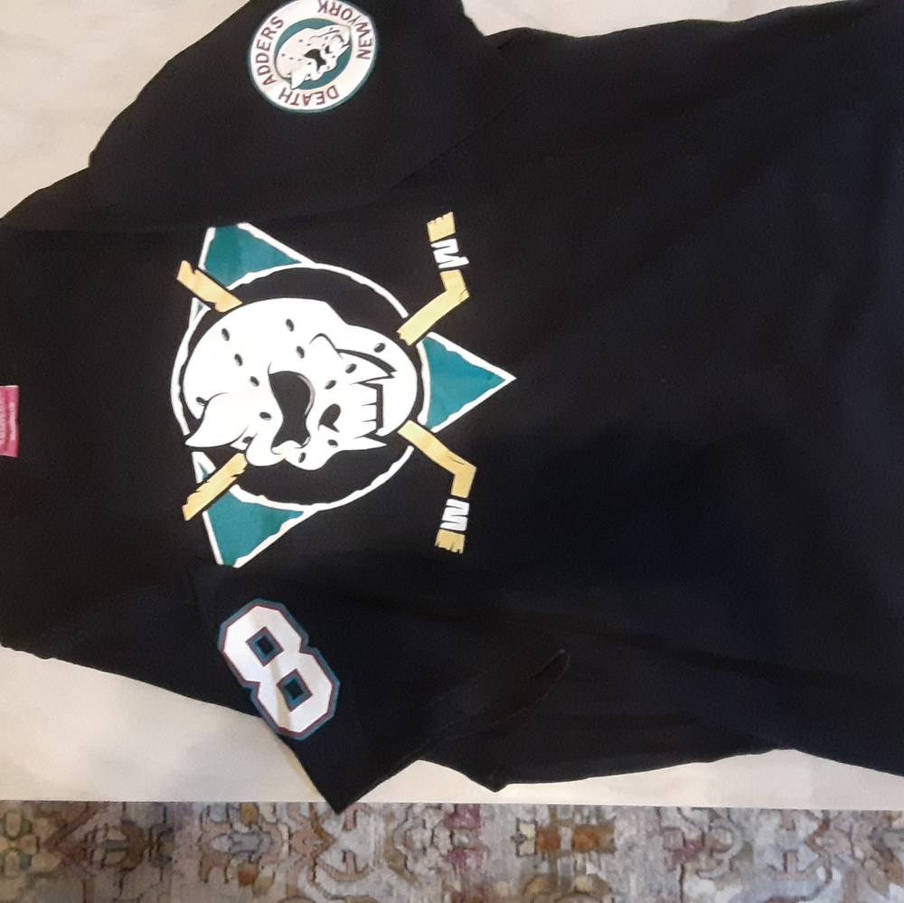 A black graphic short sleeved shirt.